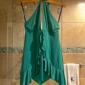 Sexy emerald green Bebe size M halter top with flowing thigh base